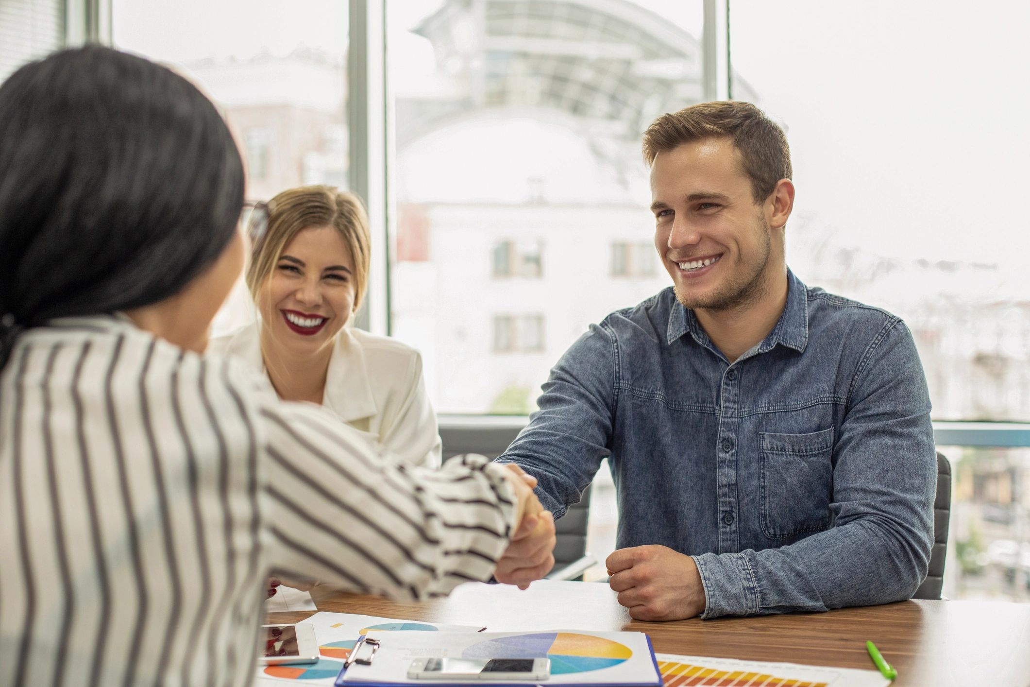 Professionals shaking hands in an office