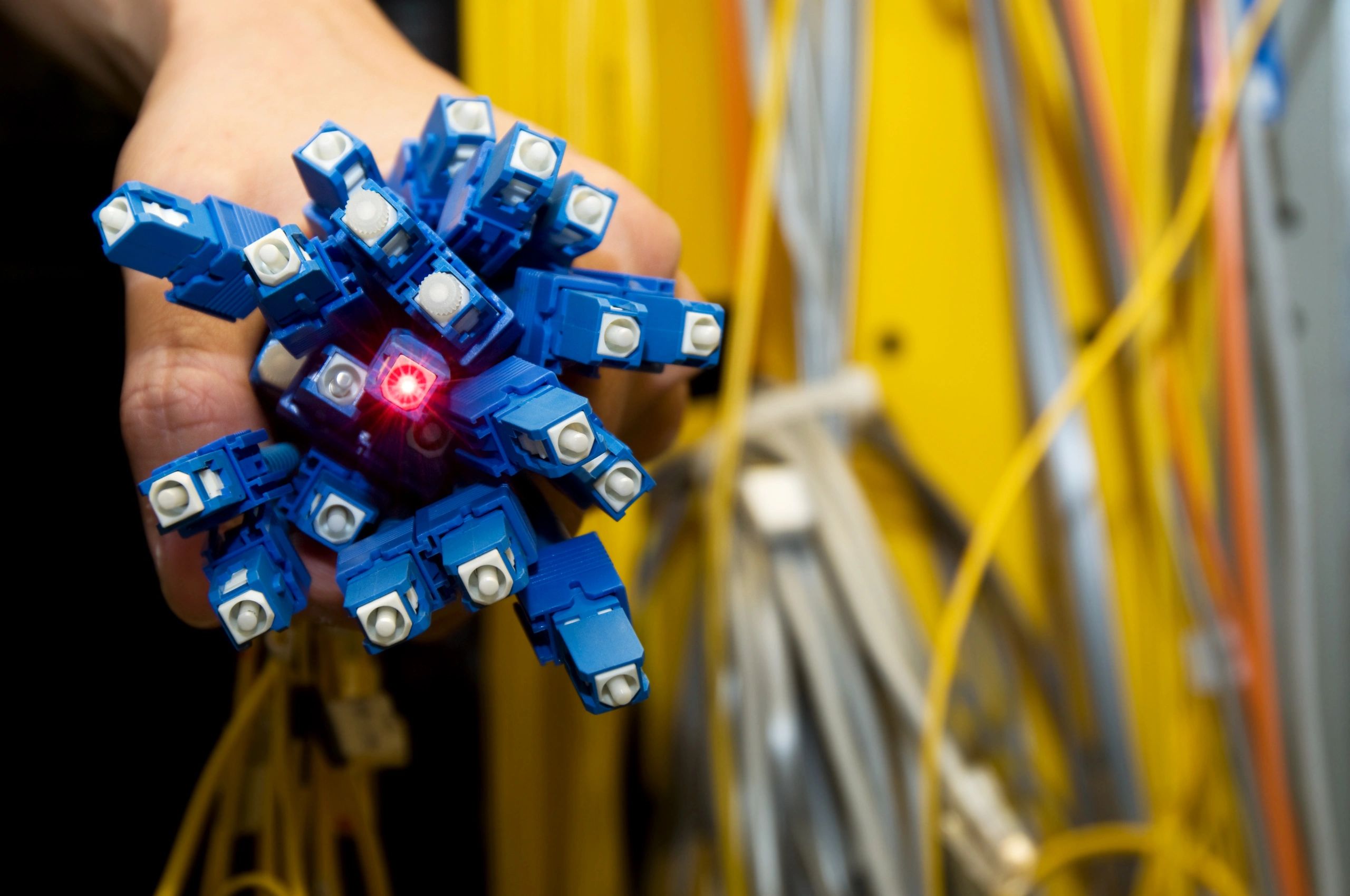Engineer holding fiber optics