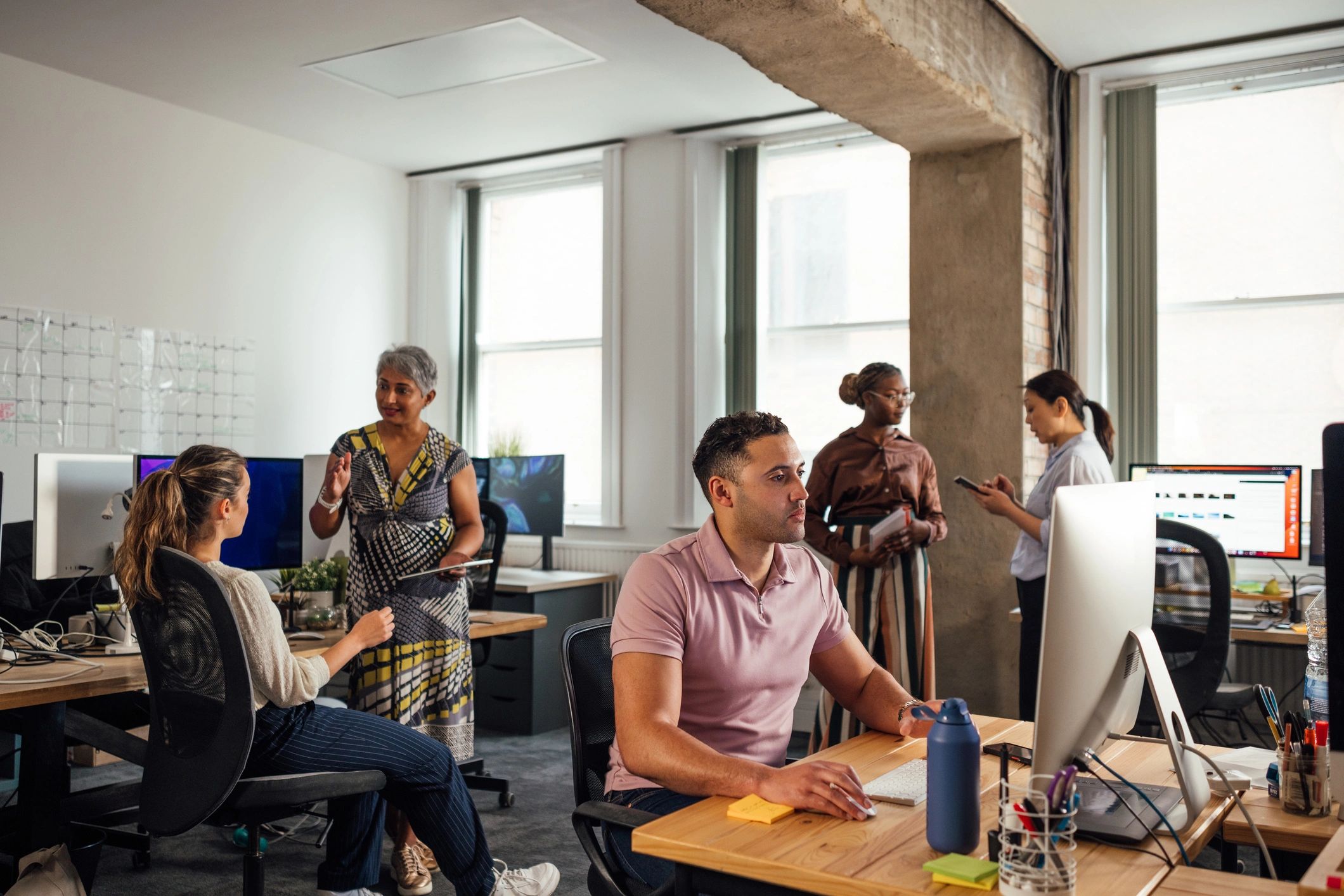 Modern office team using connected business network services
