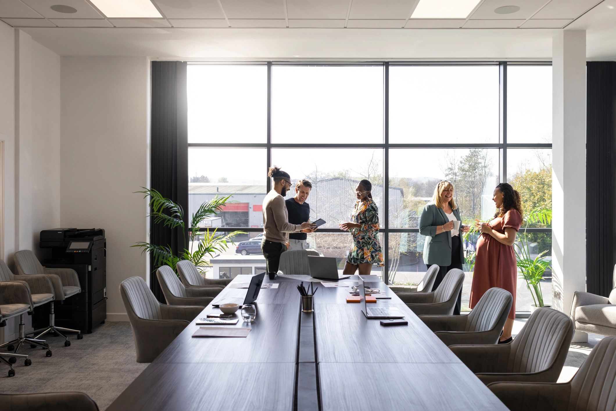 Corporate team discussing office WiFi and networking solutions